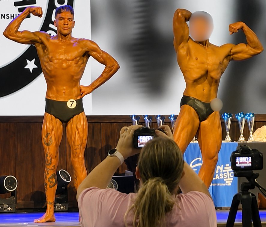 Brandon P. hitting a front double biceps at the OCB Stone Classic