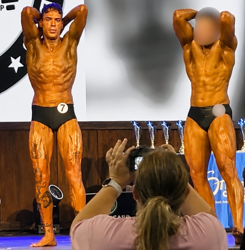 Brandon P., on the left, hitting an abdominal and thigh pose at the OCB Stone Classic