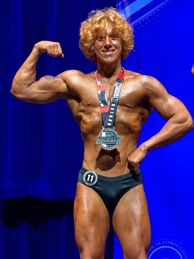 Trenton Laskey on stage with his medal, September 2024