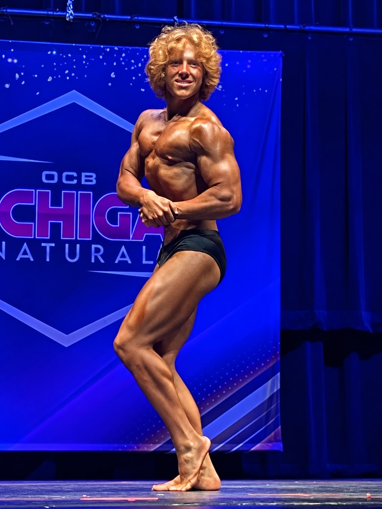 Trenton Laskey side chest on stage, September 2024